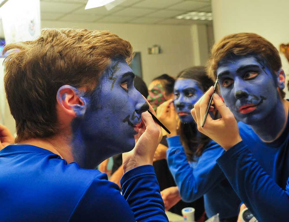 Theater students putting on makeup